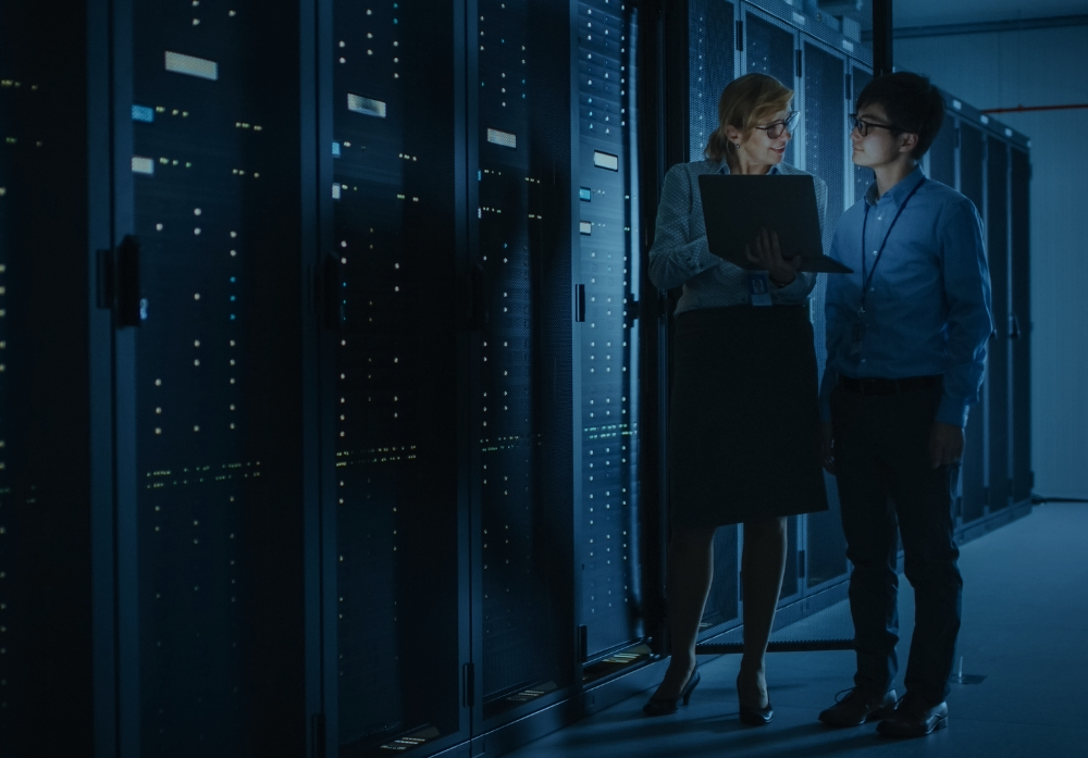 two women with lapton in data center